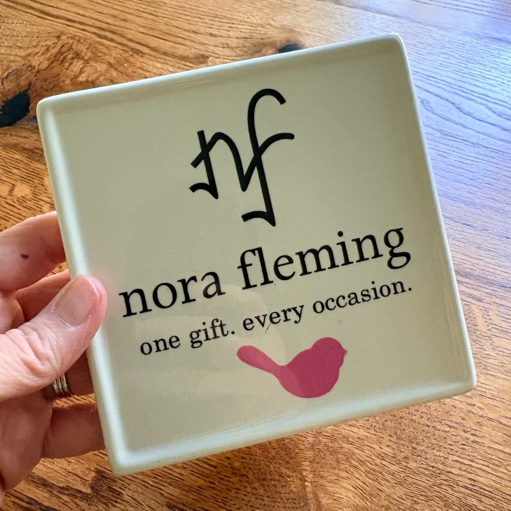 Nora Fleming Sign - White w/Pink bird “one gift. every occasion.”Retailer only